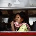 CRISE EN THAILANDE (SUITE): EVACUATION EN BUS DU CAMP OU S'ETAIENT REFUGIES, DANS LA COUR D'UN MONASTERE, LES CHEMISES ROUGES APRES L'INTERVENTION DE L'ARMEE THAILANDAISE METTANT FIN A PRES DE TROIS MOIS DE CONFLIT. thumbnail